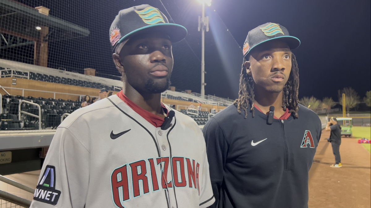 Arizona Diamondbacks infield prospect Jansel Luis (left) with Salt River Pitching Coach Tyler Mark (right) at Scottsdale Stadium.
